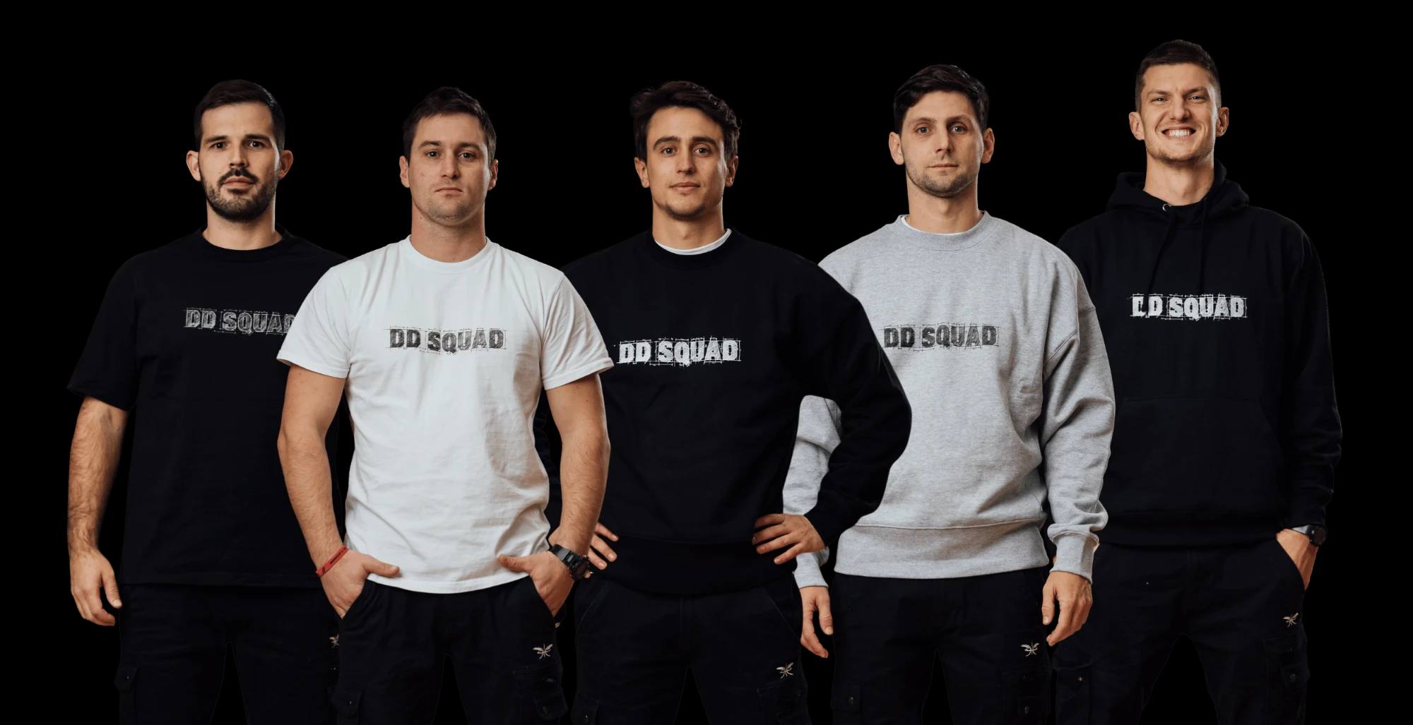 The five DD Squad members — Tadej Šolar, Gašper Novak, Jan Žnidaršič, Matevž Pogačar and Maks Veselko — standing side by side in DD Squad T-shirts, sweatshirts and hoodies.