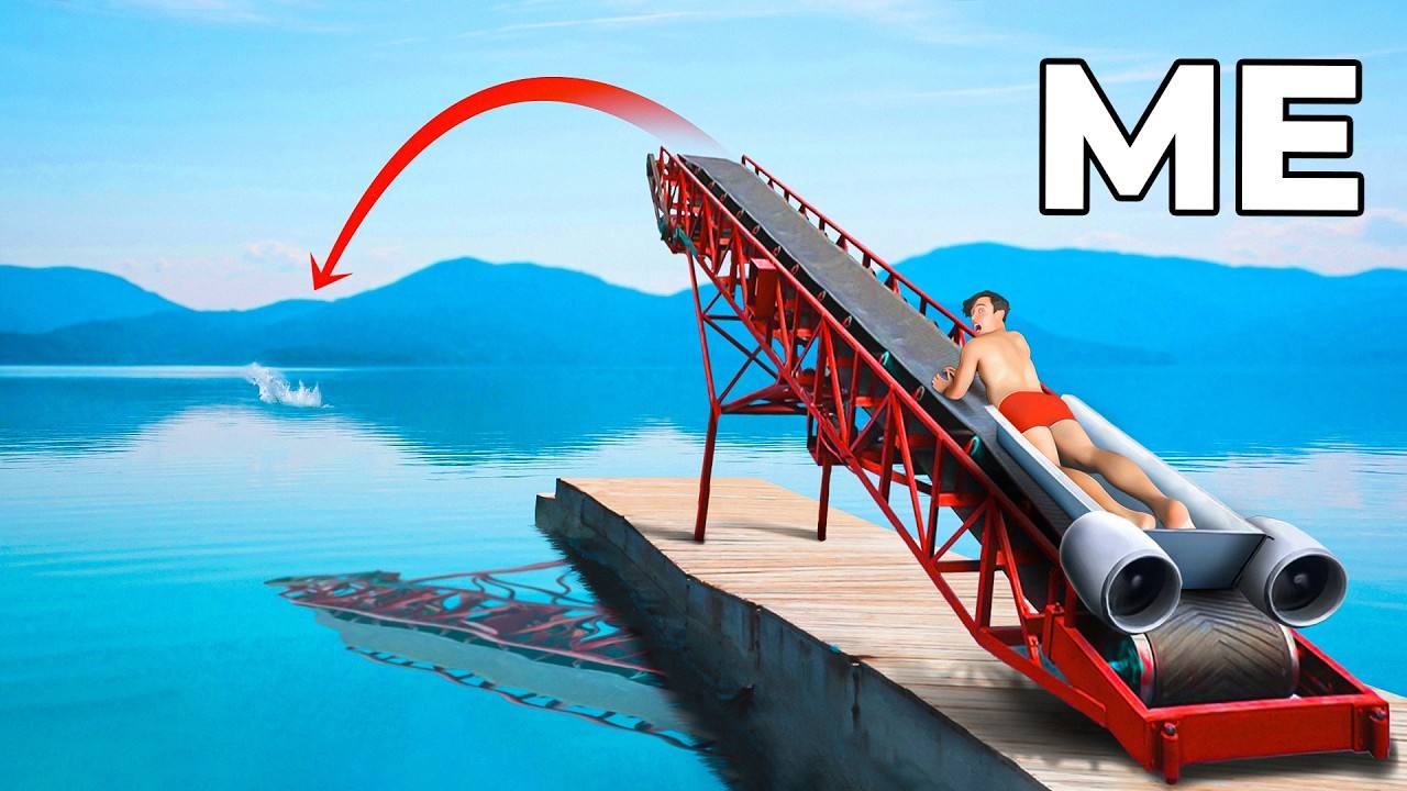 An athlete lying in DD Squad’s red human cannon ramp on a lakeside dock, aimed out over the water.